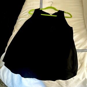 Black sleeveless top. 2 layers. Top layer shorter than bottom